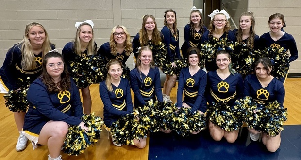 C-S Cheer Squad posing at a basketball game